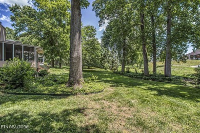 219 Oligi Circle is a charming single-story brick home located on Toqua Golf Course - Loudon County in Tennessee - for sale on GolfHomes.com, golf home, golf lot