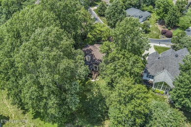 219 Oligi Circle is a charming single-story brick home located on Toqua Golf Course - Loudon County in Tennessee - for sale on GolfHomes.com, golf home, golf lot