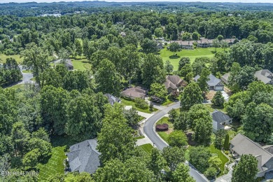 219 Oligi Circle is a charming single-story brick home located on Toqua Golf Course - Loudon County in Tennessee - for sale on GolfHomes.com, golf home, golf lot