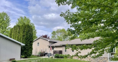 This stunning 3.7-acre in-town acreage offers the perfect blend on Oak Hills Golf Course in Iowa - for sale on GolfHomes.com, golf home, golf lot