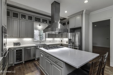 Experience timeless Southern charm blended beautifully with on Annandale Golf Club in Mississippi - for sale on GolfHomes.com, golf home, golf lot