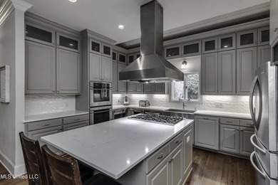 Experience timeless Southern charm blended beautifully with on Annandale Golf Club in Mississippi - for sale on GolfHomes.com, golf home, golf lot