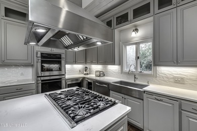 Experience timeless Southern charm blended beautifully with on Annandale Golf Club in Mississippi - for sale on GolfHomes.com, golf home, golf lot