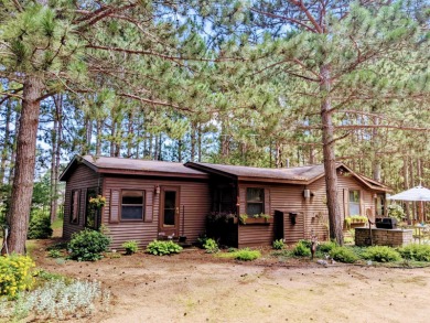 Set among tall, majestic pines sits this ranch home just waiting on Northern Bay Golf Resort and Marina in Wisconsin - for sale on GolfHomes.com, golf home, golf lot