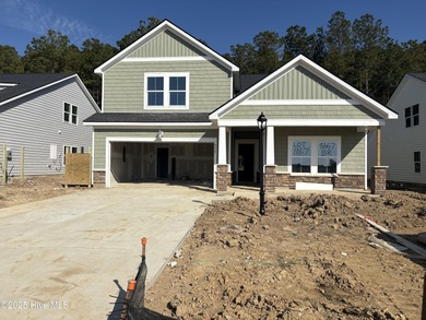 Live exceptionally in Brunswick Plantation's premier golf on Brunswick Plantation and Golf Resorts in North Carolina - for sale on GolfHomes.com, golf home, golf lot