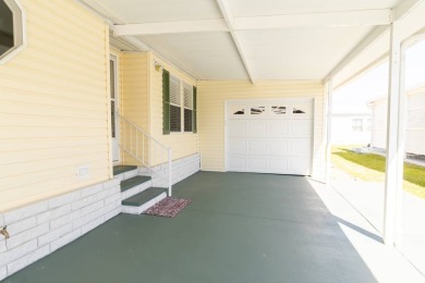 Nestled within the welcoming embrace of Whispering Pines in on Lily Lake Golf and RV Resort in Florida - for sale on GolfHomes.com, golf home, golf lot