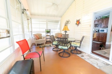 Nestled within the welcoming embrace of Whispering Pines in on Lily Lake Golf and RV Resort in Florida - for sale on GolfHomes.com, golf home, golf lot