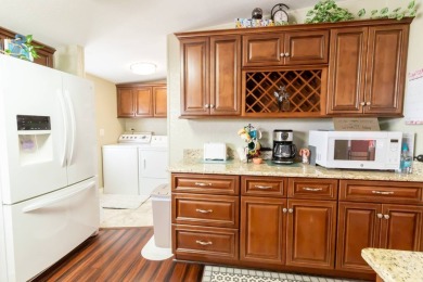 Nestled within the welcoming embrace of Whispering Pines in on Lily Lake Golf and RV Resort in Florida - for sale on GolfHomes.com, golf home, golf lot