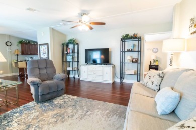 Nestled within the welcoming embrace of Whispering Pines in on Lily Lake Golf and RV Resort in Florida - for sale on GolfHomes.com, golf home, golf lot