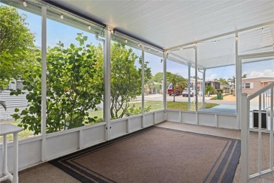 Welcome to Barefoot Bay! This cozy 2 bedroom, 2 bath home is on Barefoot Bay Golf Course in Florida - for sale on GolfHomes.com, golf home, golf lot