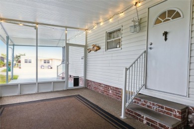 Welcome to Barefoot Bay! This cozy 2 bedroom, 2 bath home is on Barefoot Bay Golf Course in Florida - for sale on GolfHomes.com, golf home, golf lot
