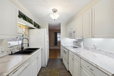 Welcome to Barefoot Bay! This cozy 2 bedroom, 2 bath home is on Barefoot Bay Golf Course in Florida - for sale on GolfHomes.com, golf home, golf lot