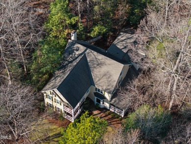 Don't miss walking over the bridge to this wonderful on Devils Ridge Golf Club in North Carolina - for sale on GolfHomes.com, golf home, golf lot