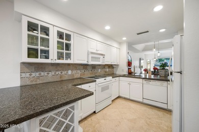 Step into this beautiful 2-bedroom, 2.5-bath townhome perfectly on Arizona Biltmore Golf and Country Club in Arizona - for sale on GolfHomes.com, golf home, golf lot