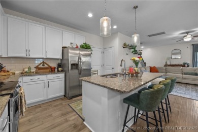 Stunning and spacious four-bedroom home with a versatile bonus on Anderson Creek Golf Club in North Carolina - for sale on GolfHomes.com, golf home, golf lot