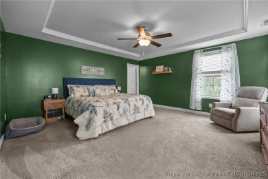 Stunning and spacious four-bedroom home with a versatile bonus on Anderson Creek Golf Club in North Carolina - for sale on GolfHomes.com, golf home, golf lot