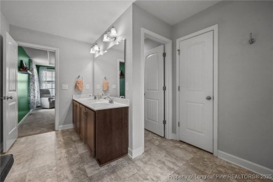 Stunning and spacious four-bedroom home with a versatile bonus on Anderson Creek Golf Club in North Carolina - for sale on GolfHomes.com, golf home, golf lot