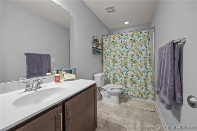 Stunning and spacious four-bedroom home with a versatile bonus on Anderson Creek Golf Club in North Carolina - for sale on GolfHomes.com, golf home, golf lot
