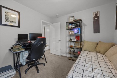 Stunning and spacious four-bedroom home with a versatile bonus on Anderson Creek Golf Club in North Carolina - for sale on GolfHomes.com, golf home, golf lot