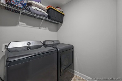 Stunning and spacious four-bedroom home with a versatile bonus on Anderson Creek Golf Club in North Carolina - for sale on GolfHomes.com, golf home, golf lot