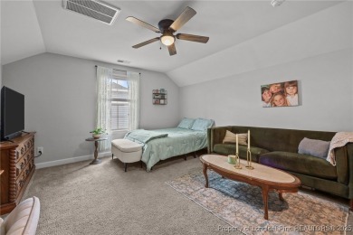 Stunning and spacious four-bedroom home with a versatile bonus on Anderson Creek Golf Club in North Carolina - for sale on GolfHomes.com, golf home, golf lot