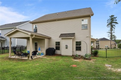 Stunning and spacious four-bedroom home with a versatile bonus on Anderson Creek Golf Club in North Carolina - for sale on GolfHomes.com, golf home, golf lot