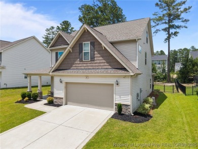 Stunning and spacious four-bedroom home with a versatile bonus on Anderson Creek Golf Club in North Carolina - for sale on GolfHomes.com, golf home, golf lot