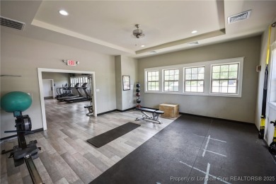 Stunning and spacious four-bedroom home with a versatile bonus on Anderson Creek Golf Club in North Carolina - for sale on GolfHomes.com, golf home, golf lot