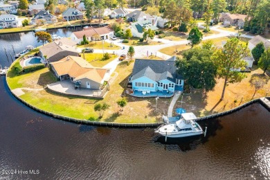 Waterfront resort home with stunning waterfront views! Dock your on Harbour Point Golf Club in North Carolina - for sale on GolfHomes.com, golf home, golf lot