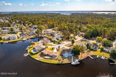 Waterfront resort home with stunning waterfront views! Dock your on Harbour Point Golf Club in North Carolina - for sale on GolfHomes.com, golf home, golf lot