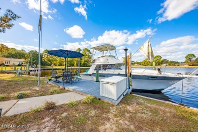 Waterfront resort home with stunning waterfront views! Dock your on Harbour Point Golf Club in North Carolina - for sale on GolfHomes.com, golf home, golf lot