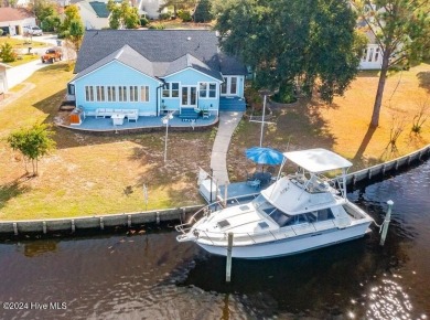 Waterfront resort home with stunning waterfront views! Dock your on Harbour Point Golf Club in North Carolina - for sale on GolfHomes.com, golf home, golf lot