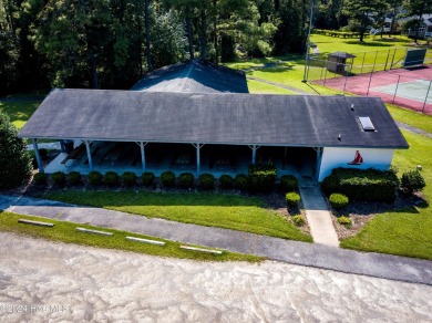 Waterfront resort home with stunning waterfront views! Dock your on Harbour Point Golf Club in North Carolina - for sale on GolfHomes.com, golf home, golf lot