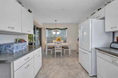 SENSATIONAL Sheffield model with EXTENDED LANAI that is enclosed on Kings Gate Golf Club in Florida - for sale on GolfHomes.com, golf home, golf lot