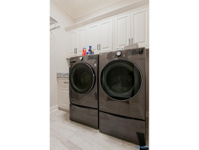 Step into this exceptional residence nestled in the coveted Cog on Canebrake Golf Club in Alabama - for sale on GolfHomes.com, golf home, golf lot