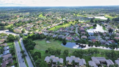 Amazing home FOR SALE located in the prestigious community of on Woodmont Country Club in Florida - for sale on GolfHomes.com, golf home, golf lot