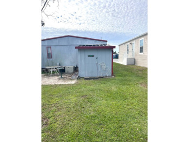 DOUBLE WIDE 2-BEDROOM, 2-BATHROOM HOME WITH AFFORDABLE LOT RENT! on YMCA Par 3 Home of the First Tee of Lakeland in Florida - for sale on GolfHomes.com, golf home, golf lot