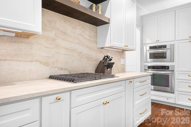 Beautifully updated and impeccably maintained, this custom brick on Cowans Ford Country Club in North Carolina - for sale on GolfHomes.com, golf home, golf lot