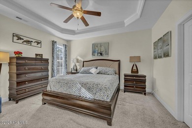 A beautifully upgraded residence in Waterford of the Carolinas on Magnolia Greens Golf Plantation in North Carolina - for sale on GolfHomes.com, golf home, golf lot