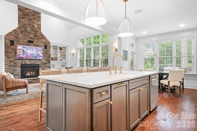Beautifully updated and impeccably maintained, this custom brick on Cowans Ford Country Club in North Carolina - for sale on GolfHomes.com, golf home, golf lot