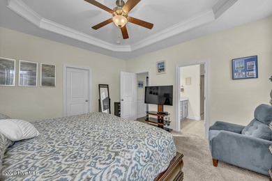 A beautifully upgraded residence in Waterford of the Carolinas on Magnolia Greens Golf Plantation in North Carolina - for sale on GolfHomes.com, golf home, golf lot