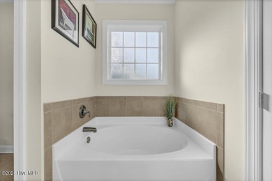 A beautifully upgraded residence in Waterford of the Carolinas on Magnolia Greens Golf Plantation in North Carolina - for sale on GolfHomes.com, golf home, golf lot