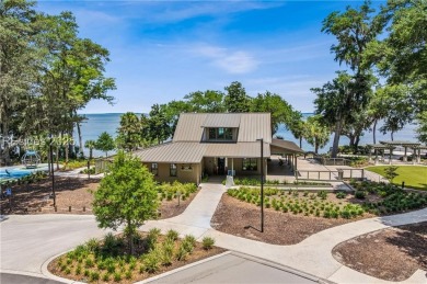 This home has soaring ceilings & a wall of 2-story windows on Bear Creek Golf Course and Club in South Carolina - for sale on GolfHomes.com, golf home, golf lot