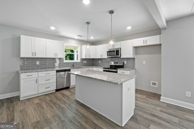 Discover this stunning 3-bedroom, 2.5-bath home with a spacious on Turtle Cove Golf Course in Georgia - for sale on GolfHomes.com, golf home, golf lot