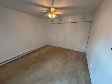 Spacious 2 bedroon, 2 bath upper level Condominium with Golf on Tuckaway Country Club in Wisconsin - for sale on GolfHomes.com, golf home, golf lot