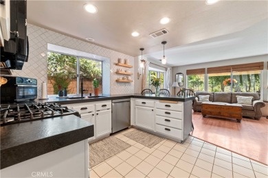 Turquoise double doors welcome you to this cheery 2 story on Wood Ranch Golf Club in California - for sale on GolfHomes.com, golf home, golf lot