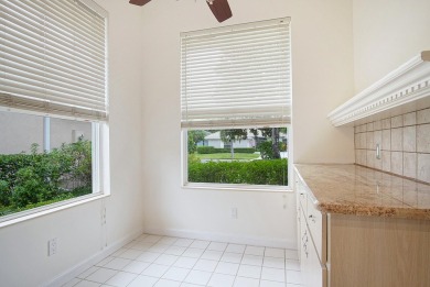 Relax looking out of this wide lake view in this freshly painted on St. Lucie Trail Golf Club in Florida - for sale on GolfHomes.com, golf home, golf lot