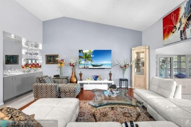 WELCOME TO 5628 PLEASANT VALLEY LANE -- A SERENE RETREAT NESTLED on Boca Delray Golf and Country Club in Florida - for sale on GolfHomes.com, golf home, golf lot