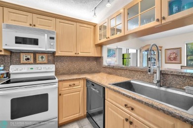 WELCOME TO 5628 PLEASANT VALLEY LANE -- A SERENE RETREAT NESTLED on Boca Delray Golf and Country Club in Florida - for sale on GolfHomes.com, golf home, golf lot