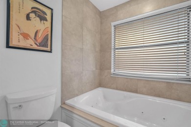 WELCOME TO 5628 PLEASANT VALLEY LANE -- A SERENE RETREAT NESTLED on Boca Delray Golf and Country Club in Florida - for sale on GolfHomes.com, golf home, golf lot